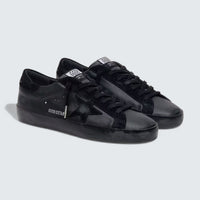 Super-Star in black nappa with black suede star and black heel tab
